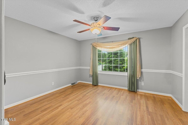 1016 Grace Dr, Johnson City, TN 37604 - spare room featuring wood finished floors, ceiling fan, a textured ceiling, and baseboards