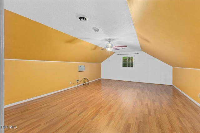 1016 Grace Dr, Johnson City, TN 37604 - bonus room featuring light wood-type flooring, ceiling fan, baseboards, lofted ceiling, and a textured ceiling