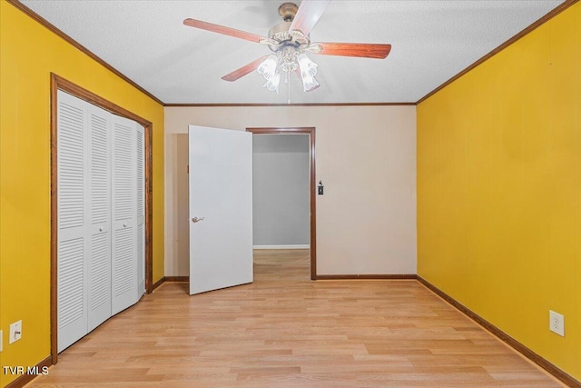 1016 Grace Dr, Johnson City, TN 37604 - unfurnished bedroom with ornamental molding, wood finished floors, a closet, a ceiling fan, and baseboards