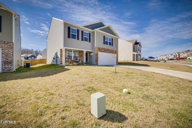 view of front of home featuring an attached garage, central AC, concrete driveway, stone siding, and a front yard