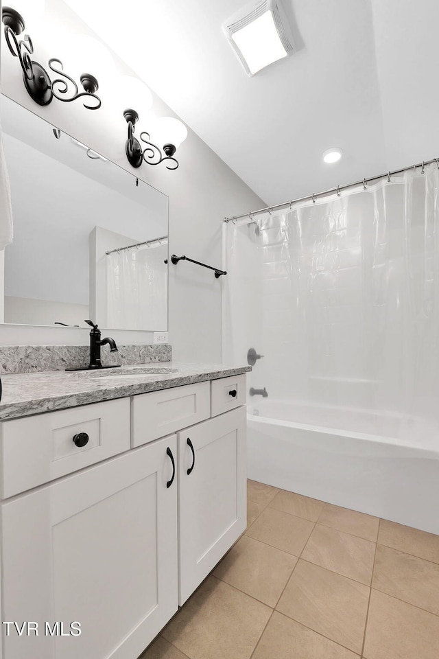 full bathroom with shower / bath combo, vanity, visible vents, and tile patterned floors