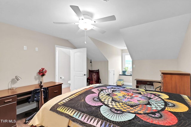 bedroom with lofted ceiling, ceiling fan, baseboards, and wood finished floors