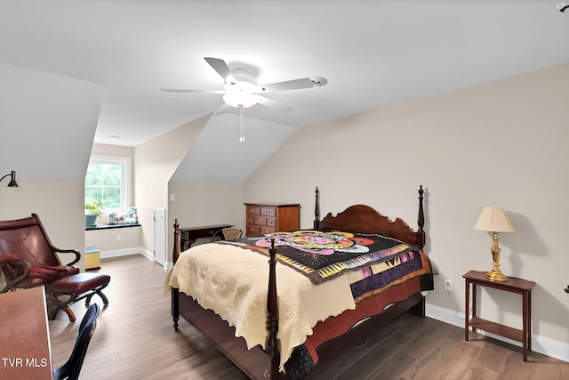 bedroom featuring vaulted ceiling, ceiling fan, dark wood finished floors, and baseboards