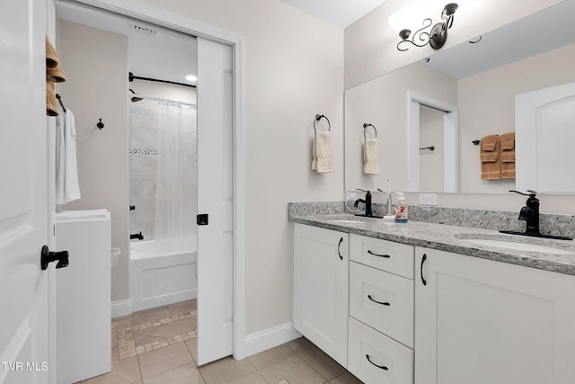 full bathroom with shower / washtub combination, tile patterned flooring, a sink, and double vanity