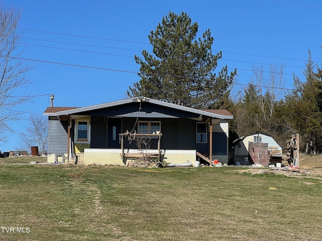 bungalow-style home with a front lawn