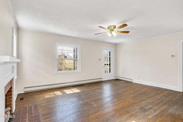 unfurnished living room with a baseboard heating unit, a brick fireplace, dark wood finished floors, and ceiling fan