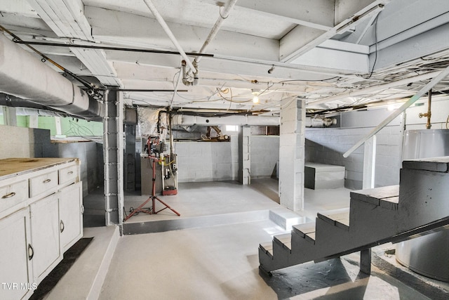 unfinished basement featuring stairway