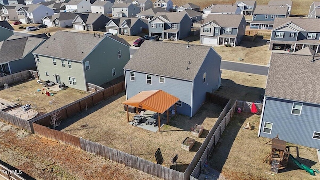 birds eye view of property with a residential view