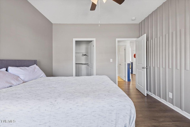 bedroom with dark wood finished floors and a ceiling fan