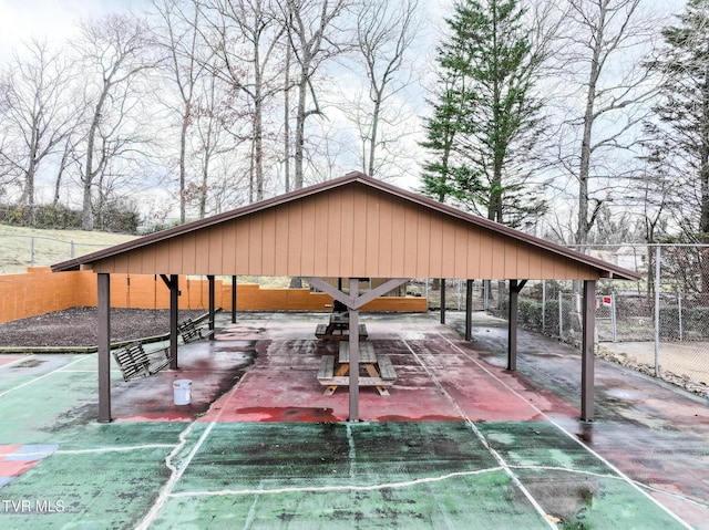 view of community featuring fence and a gazebo