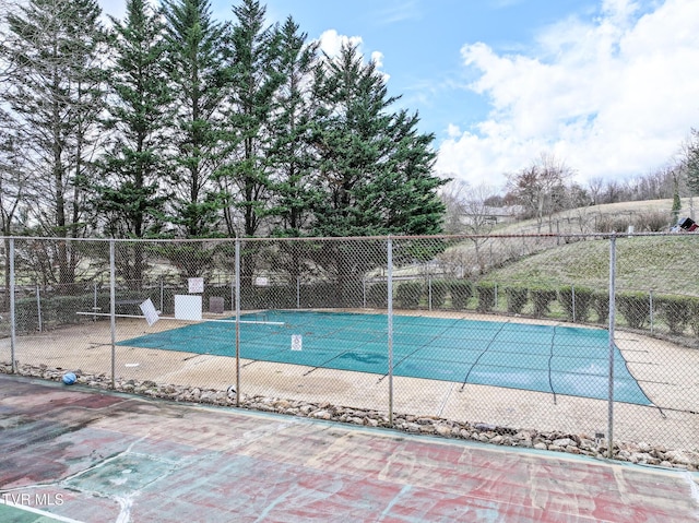 community pool with fence