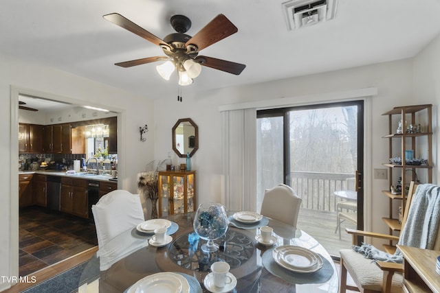 dining space featuring visible vents and ceiling fan