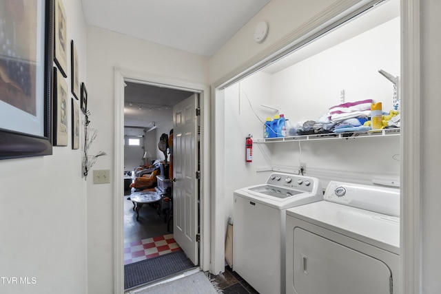 laundry area with laundry area and separate washer and dryer