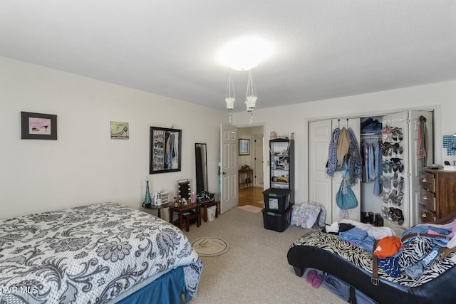 carpeted bedroom with a closet