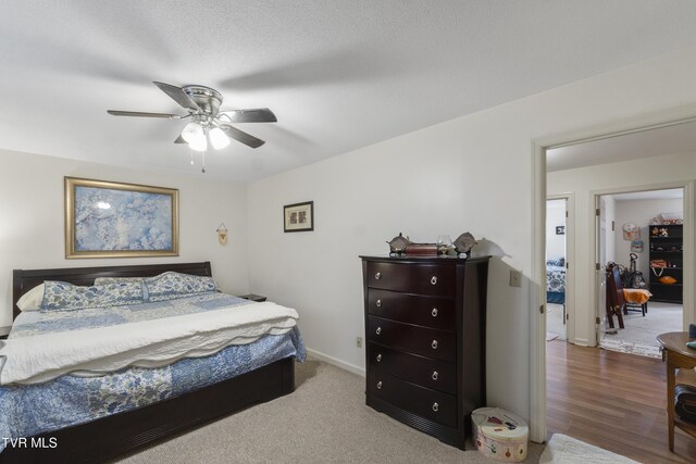 bedroom featuring a ceiling fan and baseboards