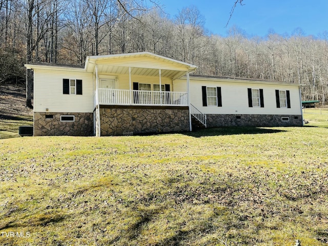 manufactured / mobile home with covered porch, crawl space, and a front yard