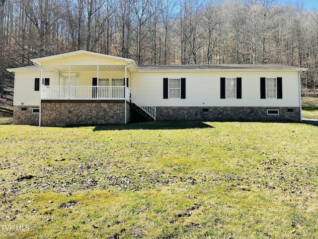 manufactured / mobile home featuring a porch, crawl space, and a front lawn