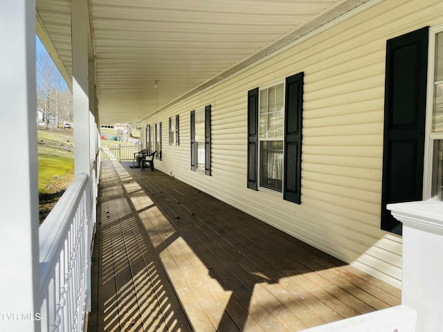 wooden terrace featuring a porch