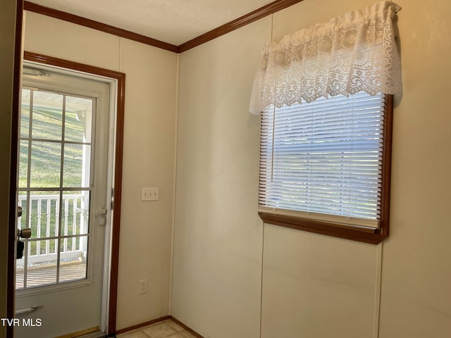 doorway featuring crown molding