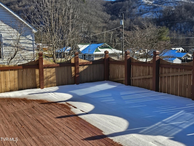 wooden terrace featuring fence