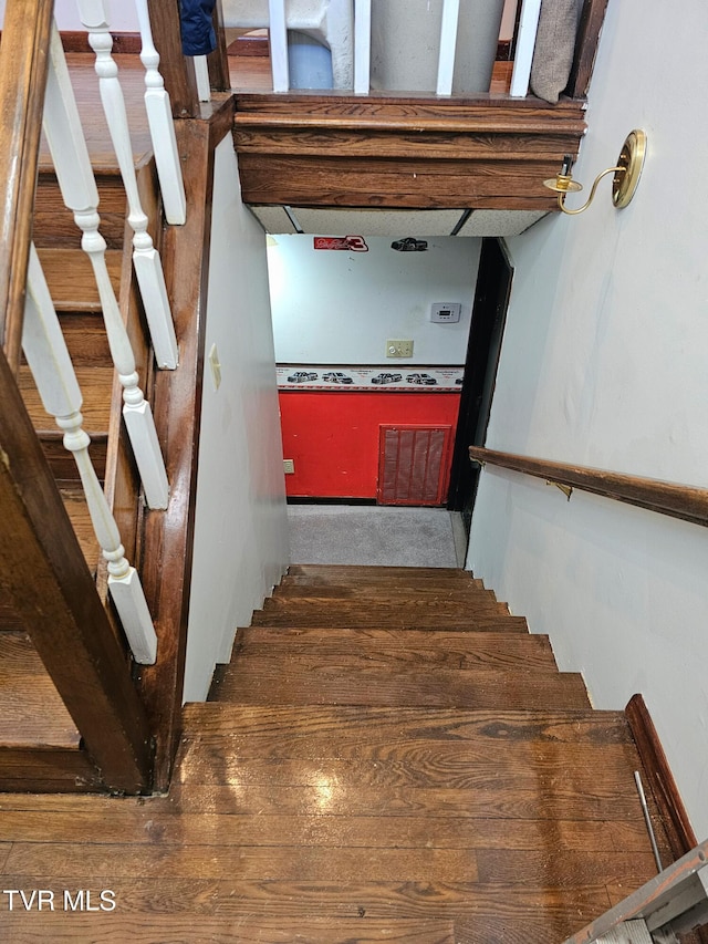 staircase featuring visible vents