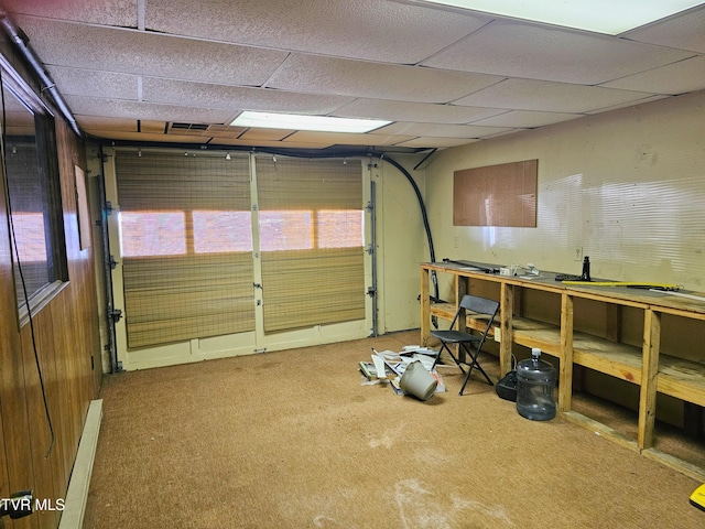 garage with a baseboard radiator and a workshop area