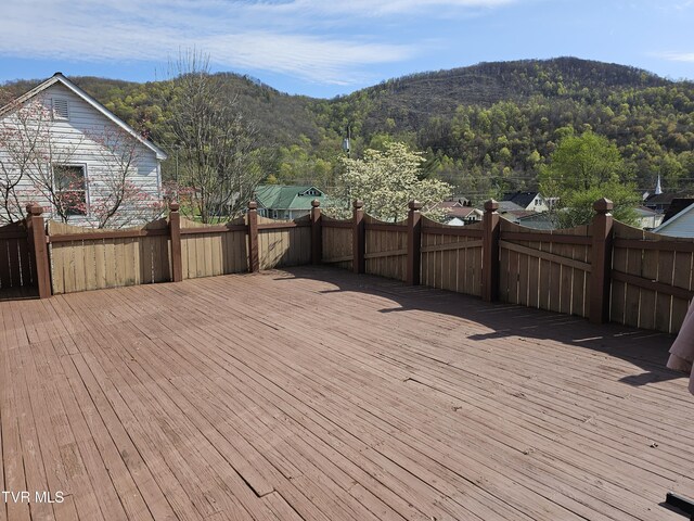 316 W Shawnee Ave, Big Stone Gap, VA 24219 - wooden deck with a mountain view and fence