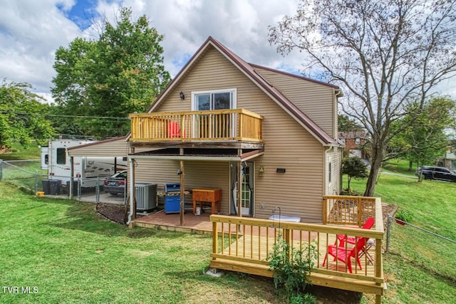 back of house with a deck, central AC unit, fence, a yard, and a detached carport