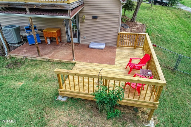 wooden deck featuring cooling unit, a yard, and fence