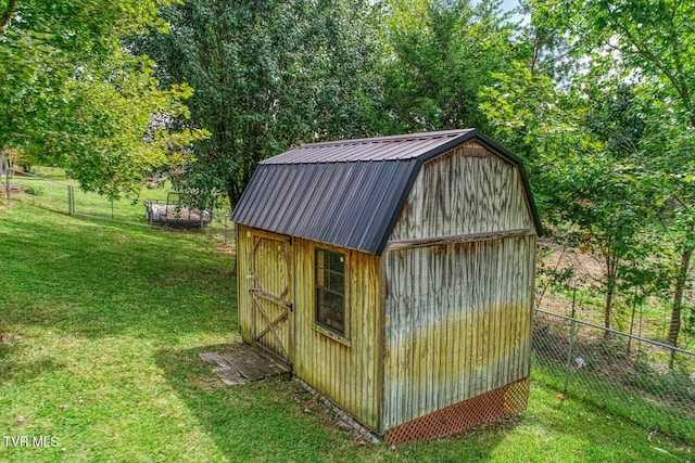 view of shed with fence