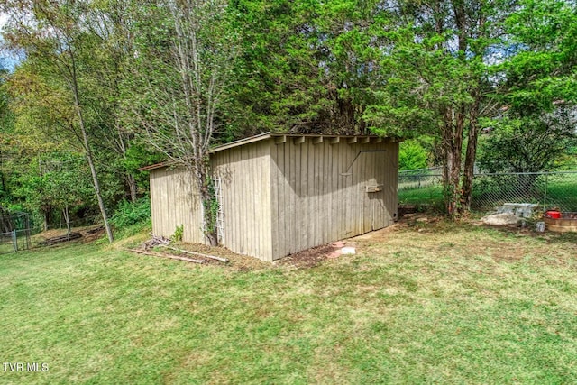 view of shed featuring fence