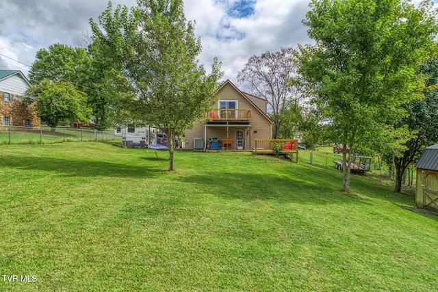 view of yard featuring a fenced backyard and a deck