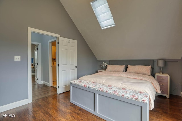 bedroom with vaulted ceiling, dark wood finished floors, and baseboards