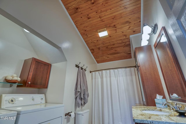 clothes washing area with laundry area, wooden ceiling, a high ceiling, washer and dryer, and a sink