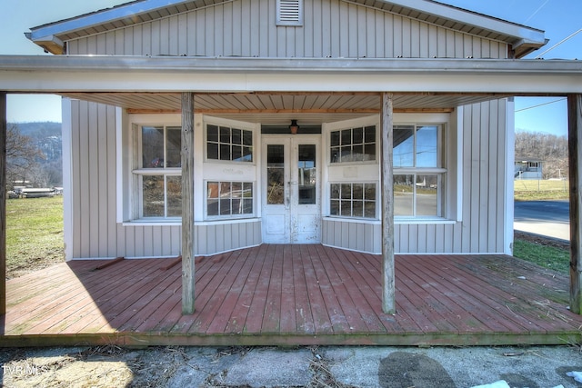 entrance to property featuring board and batten siding