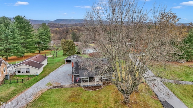 birds eye view of property featuring a mountain view