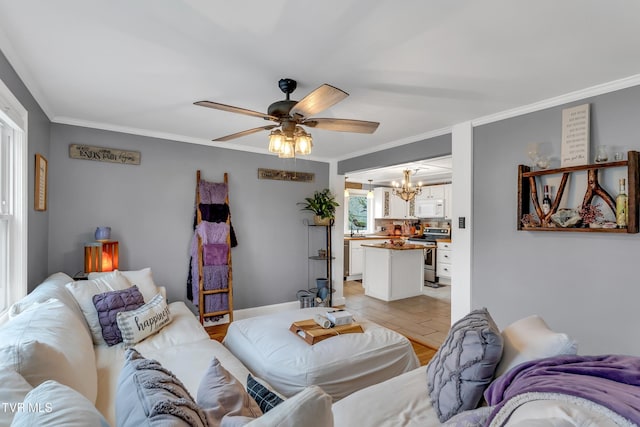 living room with ornamental molding and ceiling fan with notable chandelier