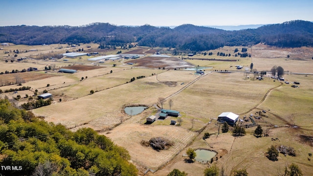 drone / aerial view with a mountain view and a rural view