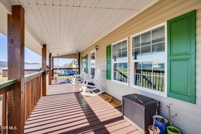 wooden terrace with a porch