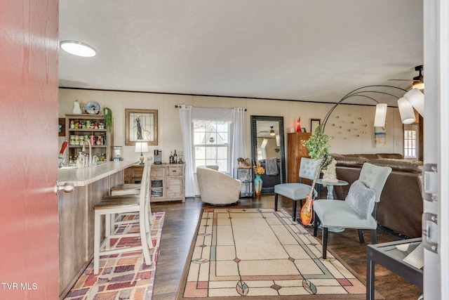 living area featuring a ceiling fan