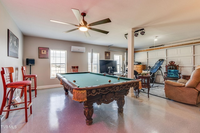 recreation room featuring a wall unit AC, billiards, a ceiling fan, and baseboards