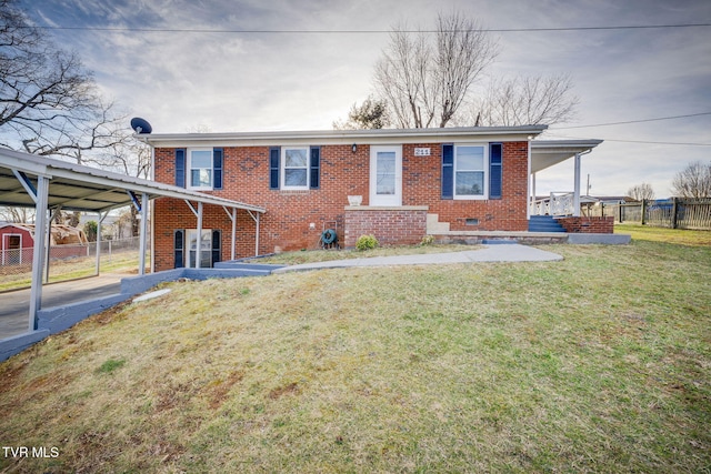 ranch-style home with brick siding, crawl space, a front yard, and fence