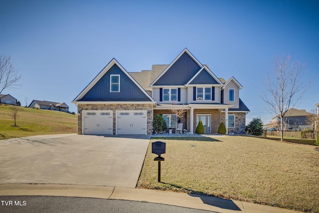 craftsman house with board and batten siding, a porch, concrete driveway, and a front yard