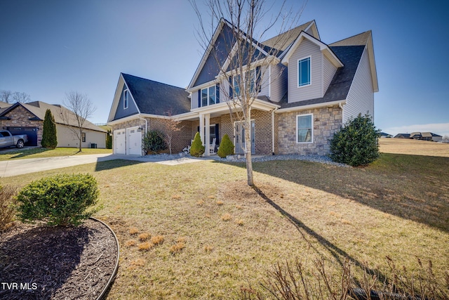 craftsman house featuring stone siding, a porch, a front lawn, and concrete driveway