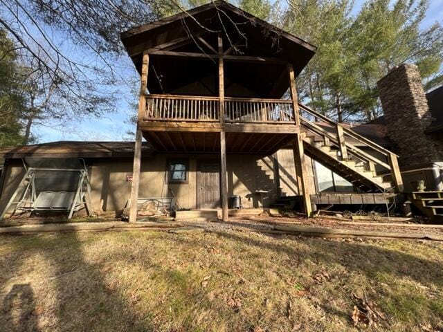 back of house featuring stairway