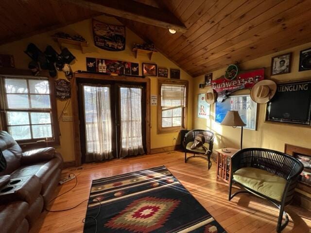 sitting room featuring lofted ceiling and wood finished floors