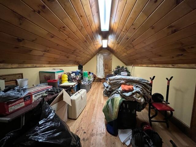 additional living space featuring lofted ceiling, wooden ceiling, and wood finished floors