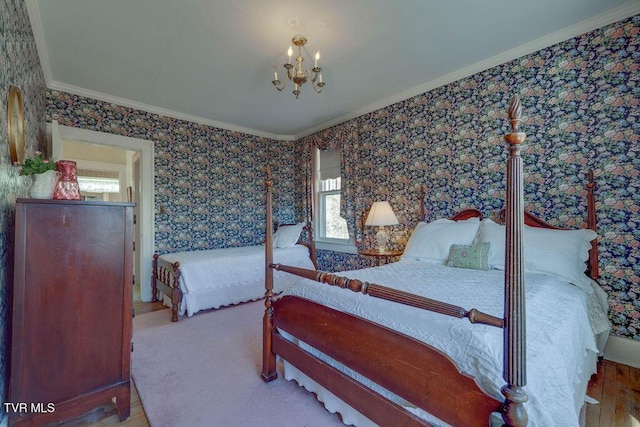 bedroom featuring wallpapered walls, ornamental molding, and an inviting chandelier