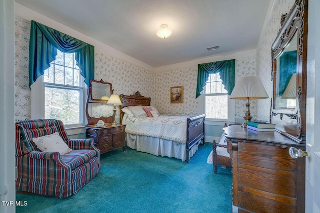 bedroom with dark colored carpet, visible vents, and wallpapered walls