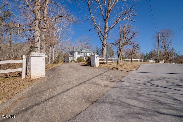 view of street featuring aphalt driveway